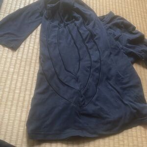 Novia black long sleeve top. Black on black design details.